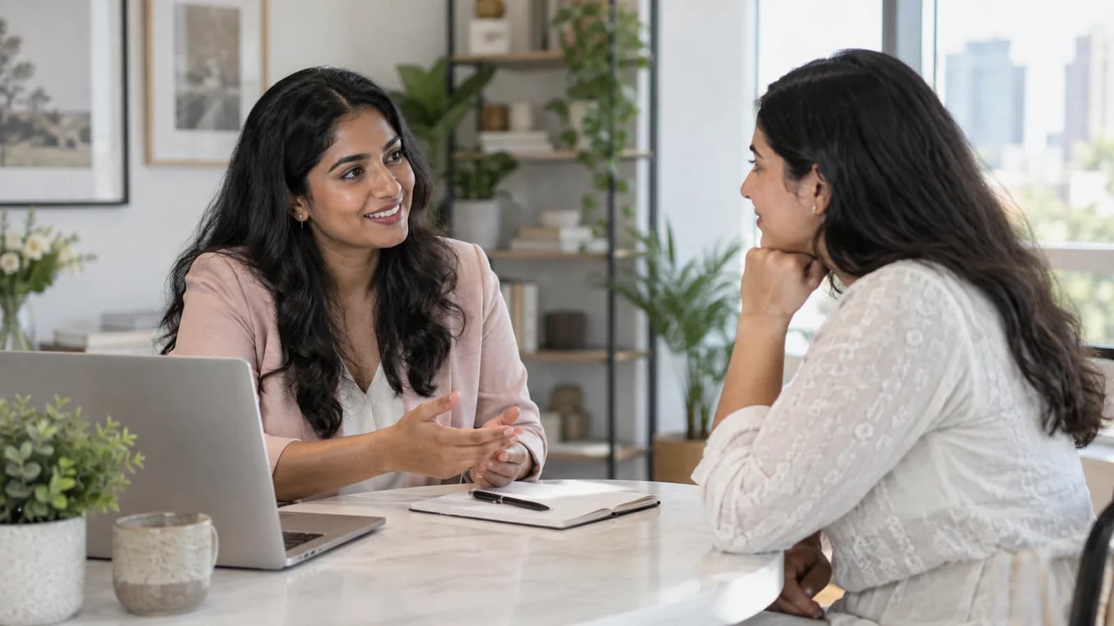 Support adviser listening to a client in a bright office